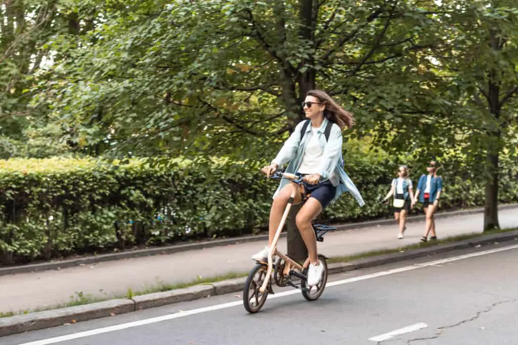 women riding a folding bike