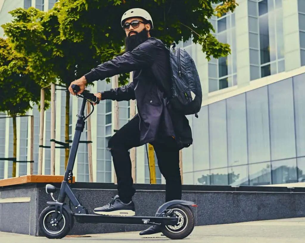 man travelling on a scooter