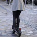 lady on an electric scooter on the road