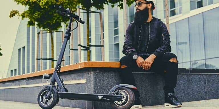 MAN WITH ELECTRIC SCOOTER